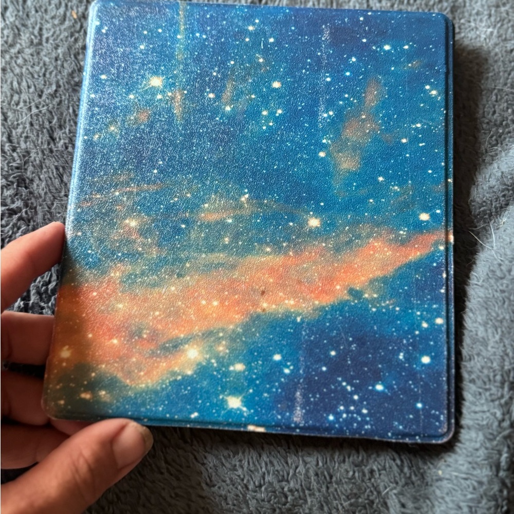 Kindle Oasis, 9th Gen.  Galaxy cover.